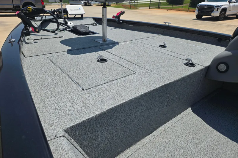 Slide: The Image of 2017 Tracker Pro Team 175 TXW boat deck with storage compartments and Garmin equipment. - 14