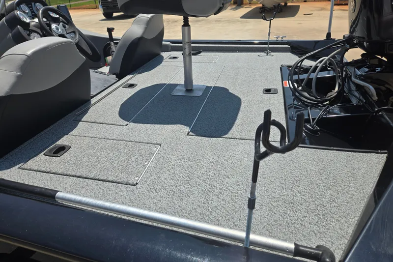 Slide: The Image of 2017 Tracker Pro Team 175 TXW boat interior with seating and fishing rod holder. - 16