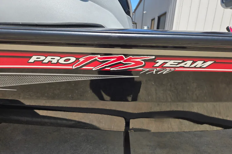 Slide: The Image of 2017 Tracker Pro Team 175 TXW boat decal, featuring bold red and white lettering. - 22