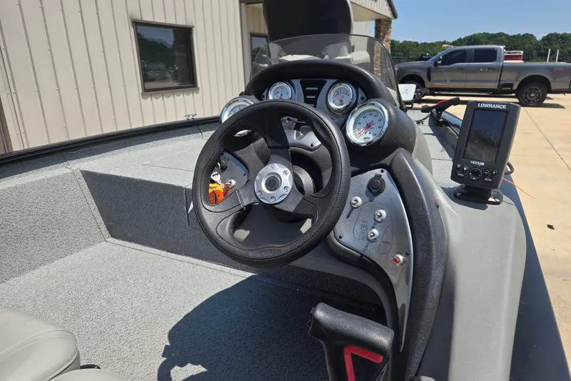 Slide: The Image of 2017 Tracker Pro Team 175 TXW boat dashboard with steering wheel and gauges. - 19