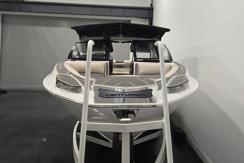 Slide: The Image of 2026 Centurion Ri245 boat displayed indoors, showcasing sleek design and modern features. - 3