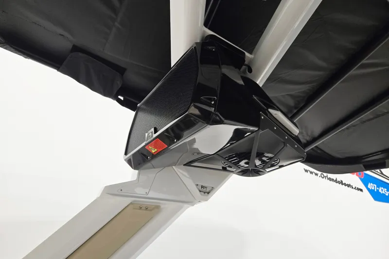 Slide: The Image of 2026 Centurion Ri245 boat speaker system under black canopy. - 13