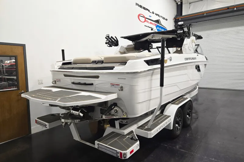 Slide: The Image of 2026 Centurion Ri245 boat in showroom, showcasing sleek design and advanced features. - 4