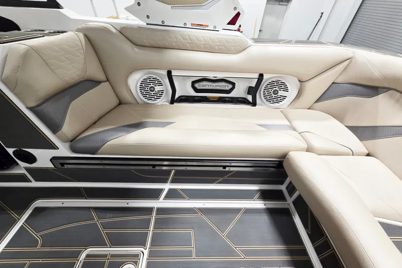 Slide: The Image of Luxurious interior of 2026 Centurion Ri245 boat with beige seating and integrated speakers. - 9