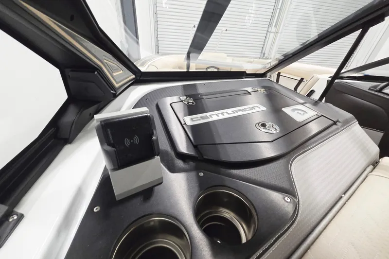 Slide: The Image of Interior view of 2026 Centurion Ri245 boat dashboard with cup holders and control panel. - 11