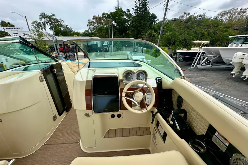 Slide: The Image of 2026 Chris-Craft Launch 35 GT boat interior with steering wheel and dashboard controls. - 5