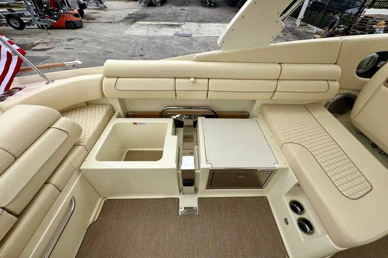 Slide: The Image of Luxurious interior of 2026 Chris-Craft Launch 35 GT boat with beige seating and storage. - 16