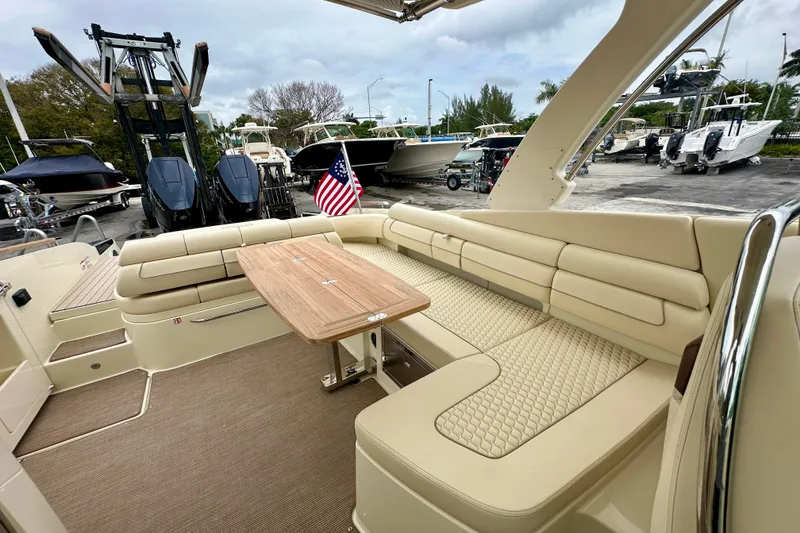 Slide: The Image of 2026 Chris-Craft Launch 35 GT interior with beige seating and wooden table. - 17