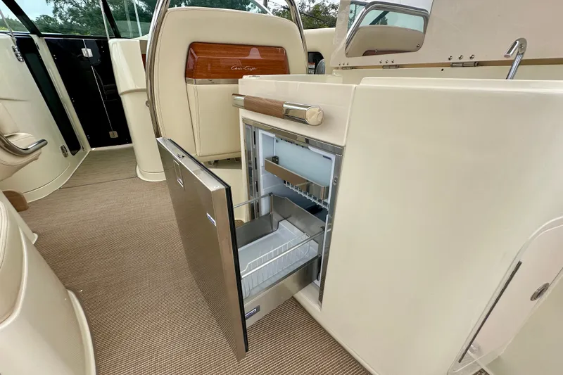Slide: The Image of Luxury interior of 2026 Chris-Craft Launch 35 GT with open mini fridge. - 14