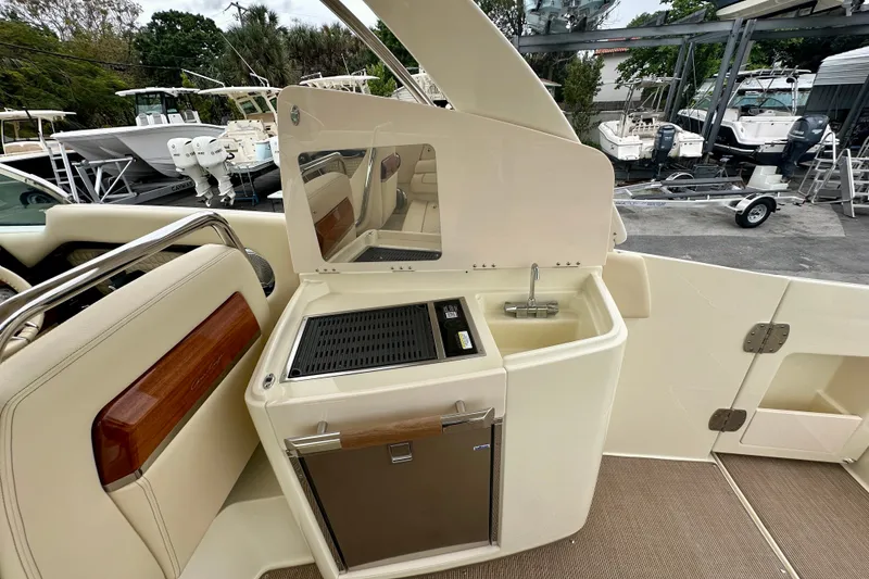 Slide: The Image of Luxurious 2026 Chris-Craft Launch 35 GT boat interior with sink and mini-fridge. - 13