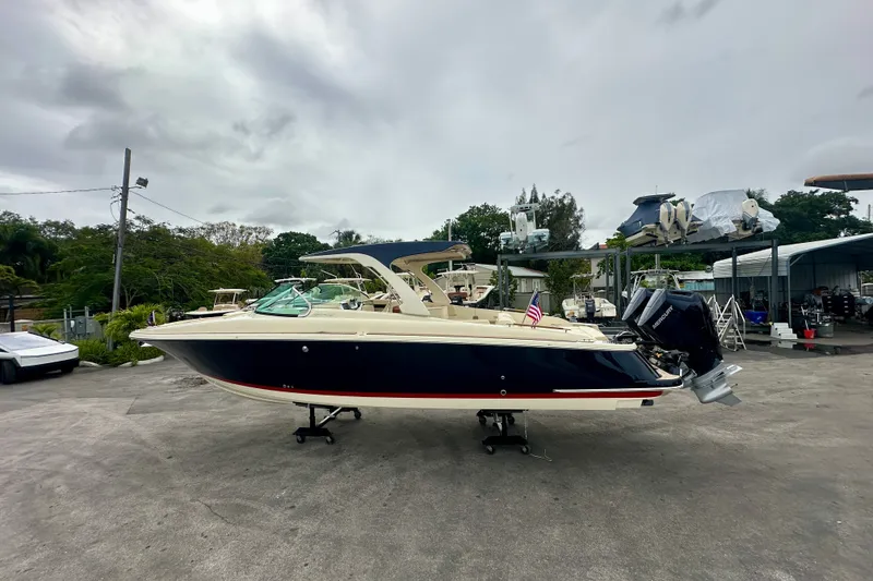 The Image of 2026 Chris-Craft Launch 35 GT boat on display in a marina setting. - 0