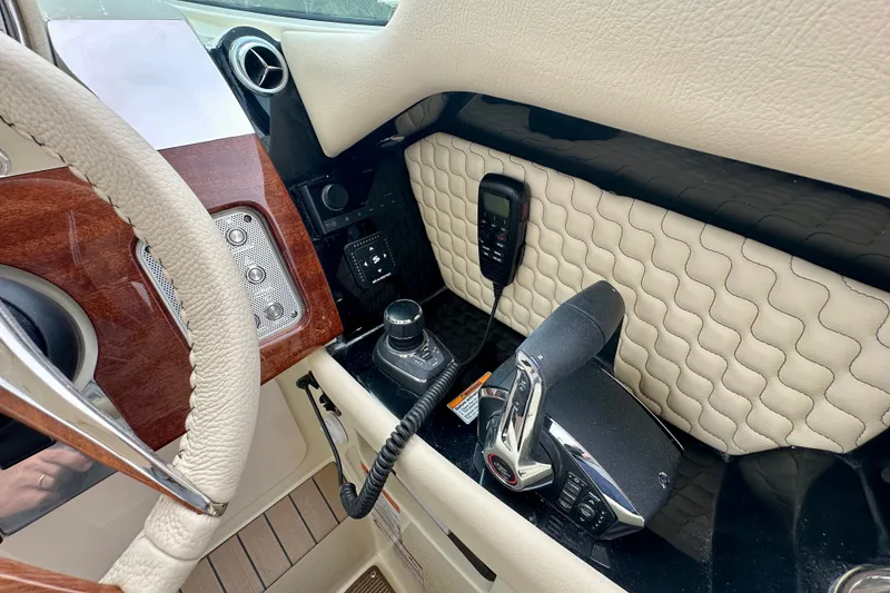 Slide: The Image of Interior of 2026 Chris-Craft Launch 35 GT, featuring luxurious controls and steering wheel. - 6