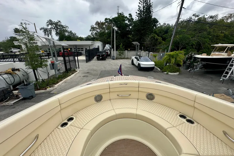 Slide: The Image of 2026 Chris-Craft Launch 35 GT boat with luxurious seating in a marina setting. - 9