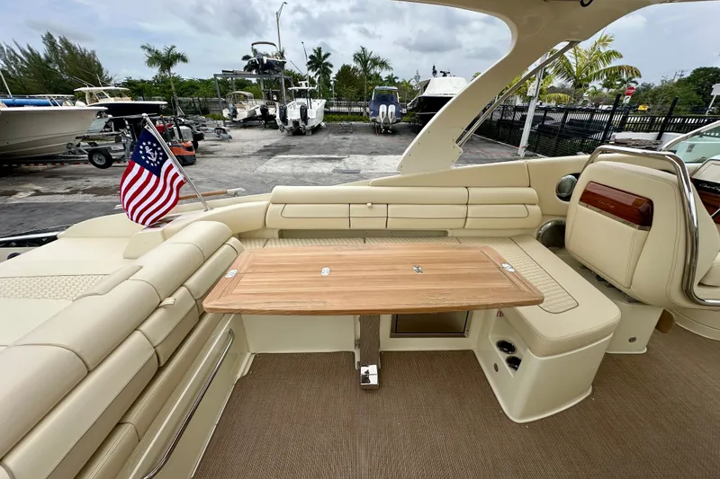 Slide: The Image of Luxurious 2026 Chris-Craft Launch 35 GT boat interior with elegant seating and wooden table. - 18
