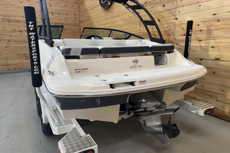 Slide: The Image of 2025 Regal 2000 ES boat in showroom, featuring sleek design and modern amenities. - 3