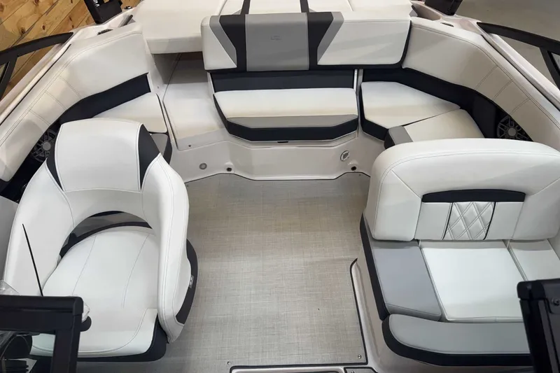Slide: The Image of Luxurious interior of 2025 Regal 2000 ES boat with white and gray seating. - 8