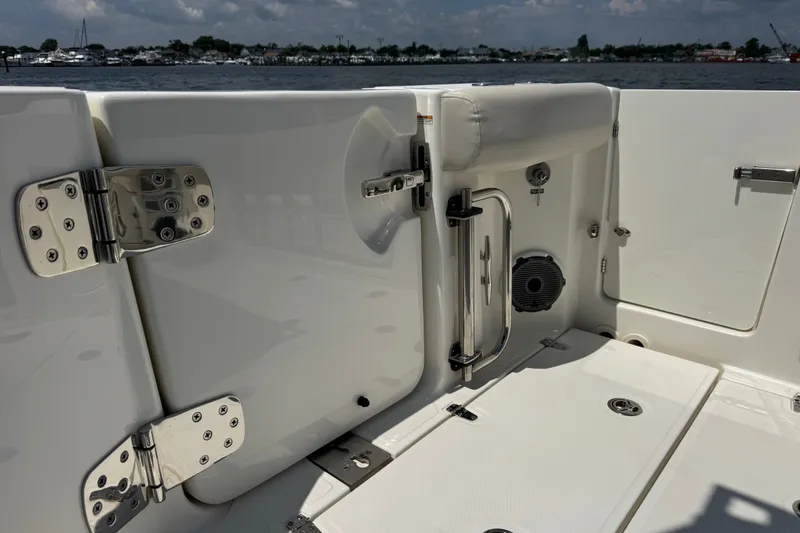 Slide: The Image of 2023 Boston Whaler 325 Conquest boat interior, featuring sleek design and stainless steel fixtures. - 12