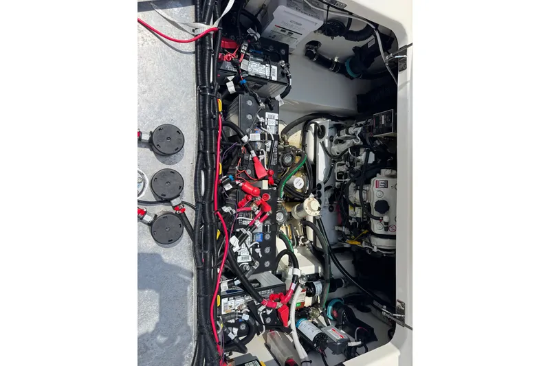 Slide: The Image of Engine compartment of 2023 Boston Whaler 325 Conquest, showcasing wiring and components. - 29