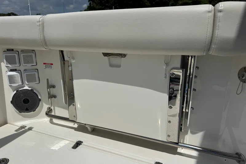 Slide: The Image of 2023 Boston Whaler 325 Conquest boat interior with speaker and control panel. - 11