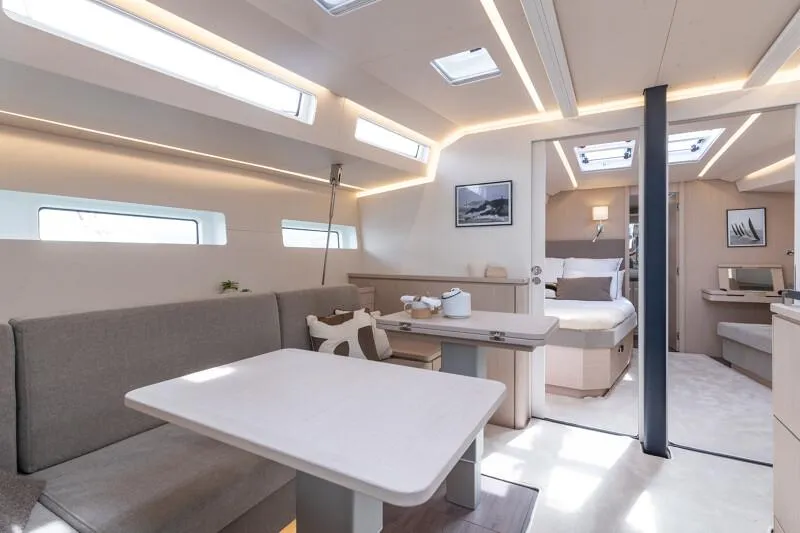 Slide: The Image of Manufacturer Provided Image: Luxurious interior of 2026 Jeanneau 55 yacht with modern dining and sleeping areas. - 5