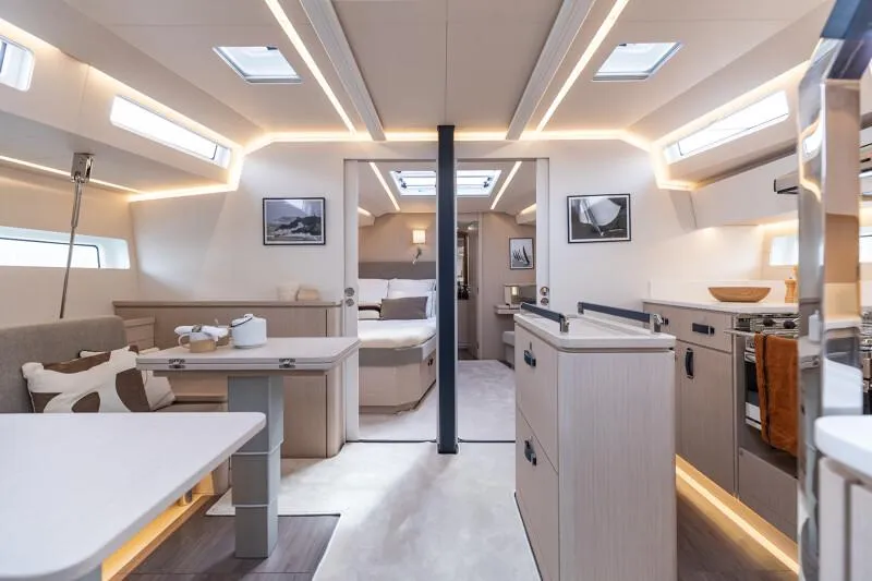 Slide: The Image of Manufacturer Provided Image: Luxurious interior of 2026 Jeanneau 55 yacht with modern kitchen and cozy seating area. - 6