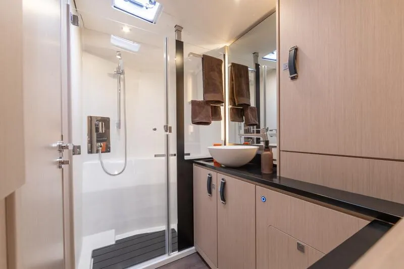 Slide: The Image of Manufacturer Provided Image: Modern bathroom in 2026 Jeanneau 55 yacht with sleek fixtures and elegant design. - 10
