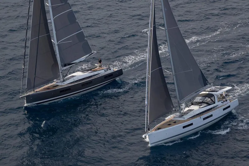 Slide: The Image of Manufacturer Provided Image: 2025 Jeanneau 60 sailboats navigating open sea, showcasing sleek design and performance. - 4