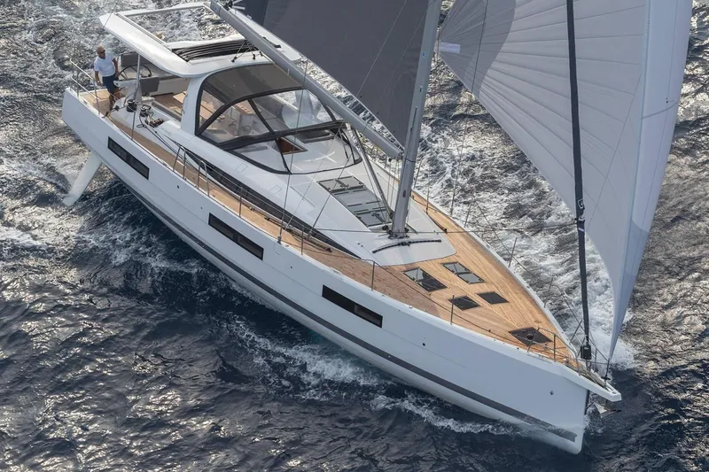 The Image of Manufacturer Provided Image: 2025 Jeanneau 60 sailing yacht navigating ocean waters with sleek design and modern features. - 0
