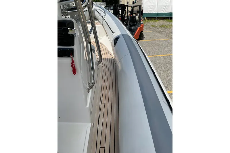 Slide: The Image of 2015 Protector 30 Center Console boat with sleek deck and railing design. - 16