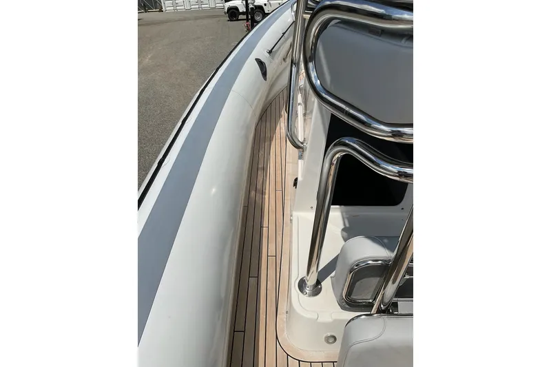 Slide: The Image of 2015 Protector 30 Center Console boat deck with stainless steel railings. - 15