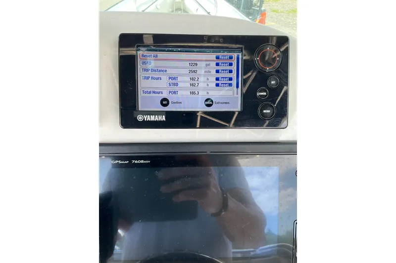 Slide: The Image of Yamaha boat console display showing trip data on a 2015 Protector 30 Center Console. - 22