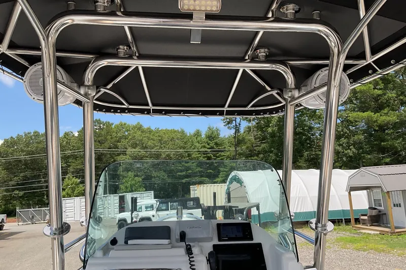 Slide: The Image of 2015 Protector 30 Center Console boat with T-top and navigation equipment. - 27