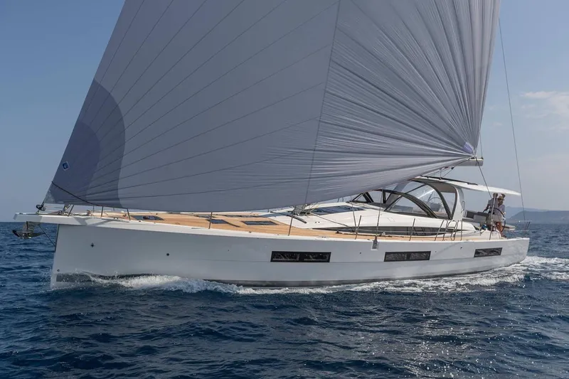 The Image of Manufacturer Provided Image: 2025 Jeanneau 60 yacht sailing on open sea with full sails. - 0