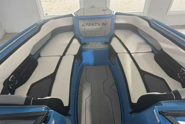 Slide: The Image of 2022 Yamaha Boats 255XD interior with sleek seating and modern design. - 11