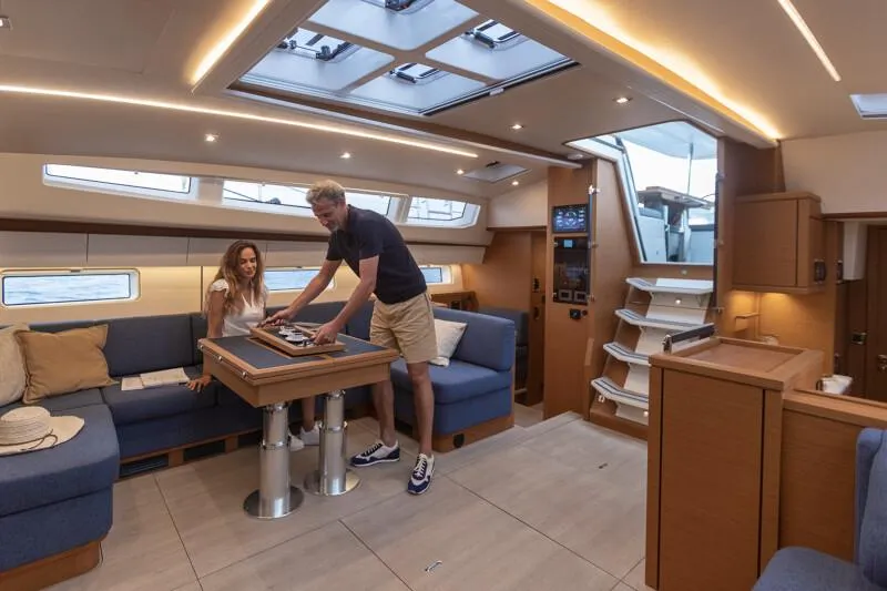 Slide: The Image of Manufacturer Provided Image: Luxurious interior of 2026 Jeanneau 65 yacht with modern seating and skylights. - 7