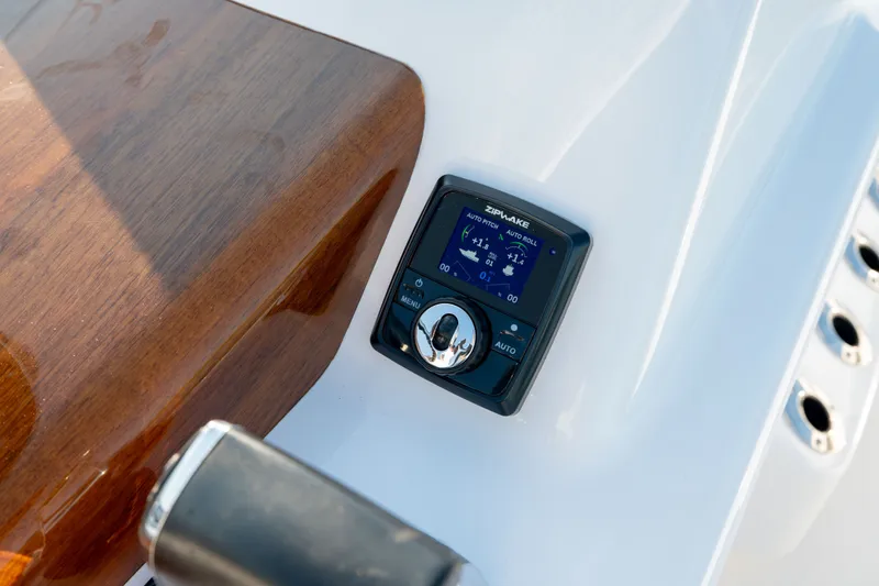 Slide: The Image of Control panel on 2021 Harrison Boatworks 23 Center Console, featuring Zipwake system. - 16