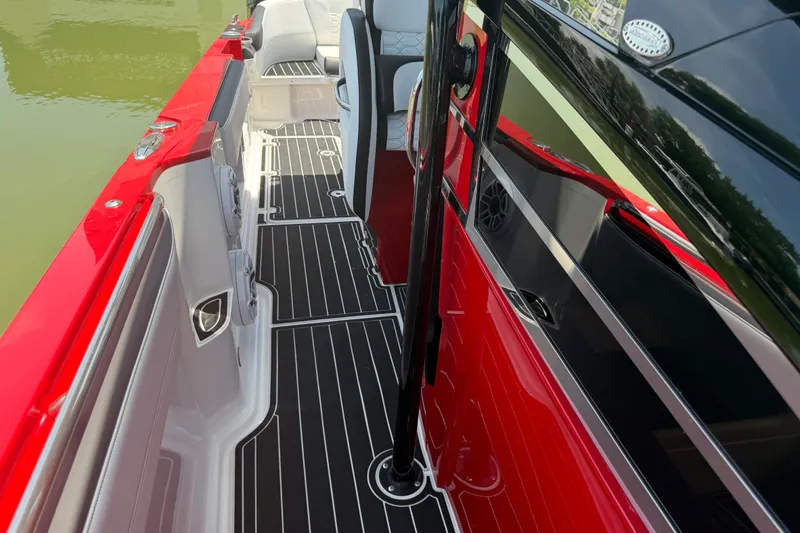 Slide: The Image of 2024 Nor-Tech 390 Sport boat interior with sleek red and black design. - 21