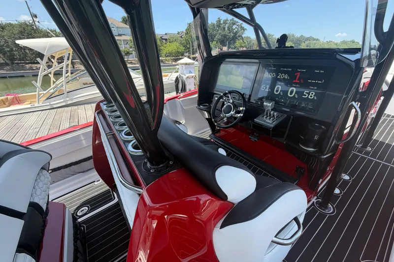 Slide: The Image of 2024 Nor-Tech 390 Sport boat cockpit with advanced navigation display and sleek design. - 41