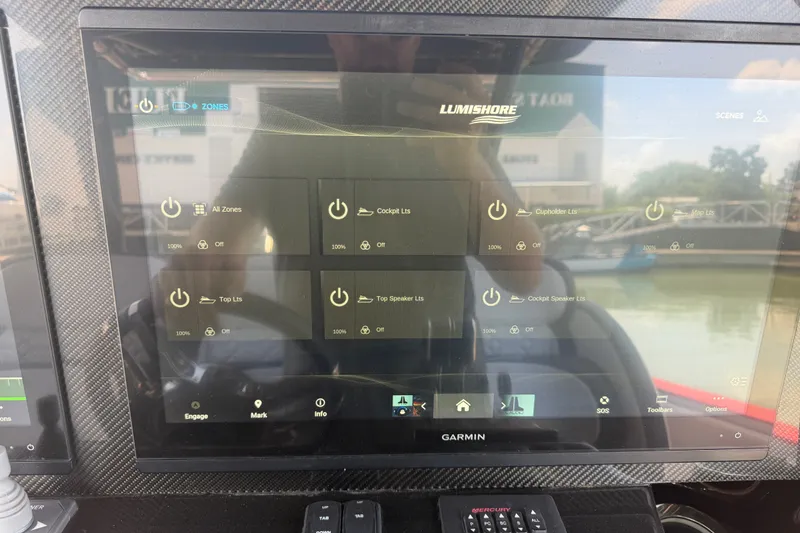 Slide: The Image of Garmin display on 2024 Nor-Tech 390 Sport showing Lumishore lighting controls. - 32