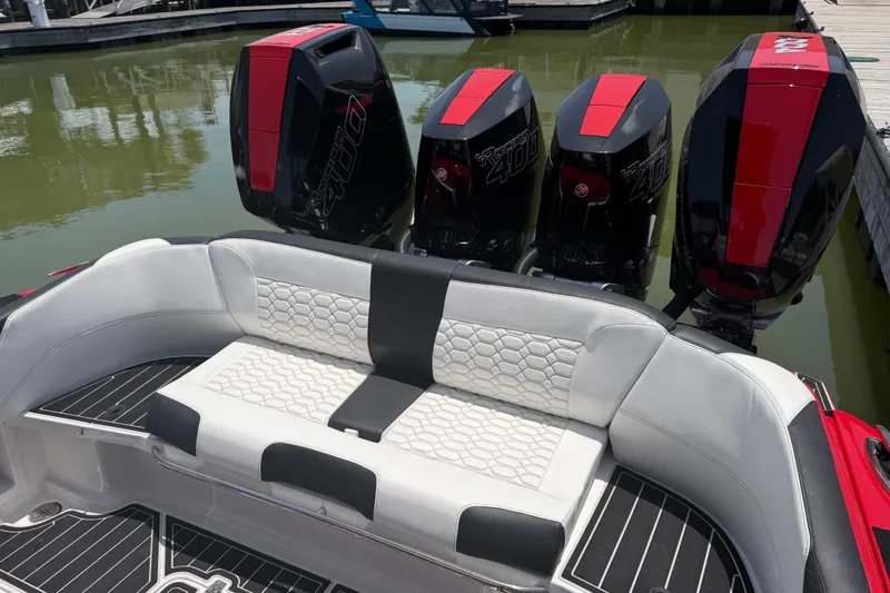 Slide: The Image of 2024 Nor-Tech 390 Sport boat with quad Mercury Racing 400R engines, featuring luxurious seating. - 48