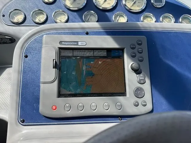 Slide: The Image of The image shows a navigation system on a 2004 Bayliner 305SB boat. - 14