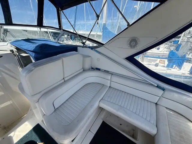 Slide: The Image of The image shows the cockpit of a 2004 Bayliner 305SB with white upholstered seating. - 6