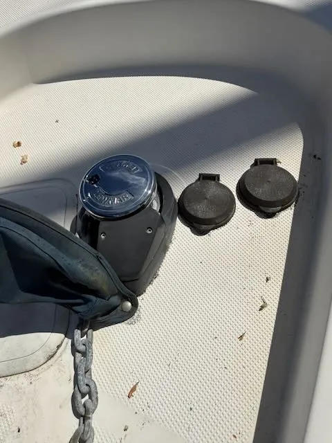 Slide: The Image of Close-up of an anchor system on a boat, featuring a chain and covers. - 29