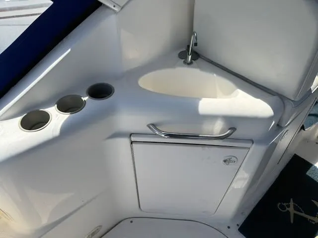 Slide: The Image of The image shows a sink with a faucet and three cup holders on a boat. - 5