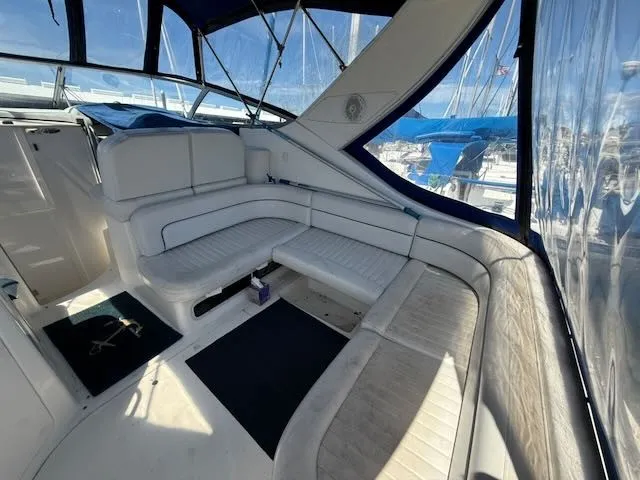 Slide: The Image of The image shows the cockpit of a 2004 Bayliner 305SB with white cushioned seating and blue accents. - 4