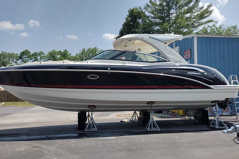 Slide: The Image of 2026 Formula 350 Crossover Bowrider on display outdoors, showcasing sleek design and modern features. - 2