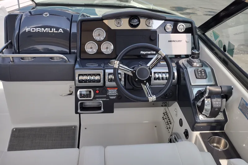 Slide: The Image of 2026 Formula 350 Crossover Bowrider dashboard with steering wheel and control panel. - 21