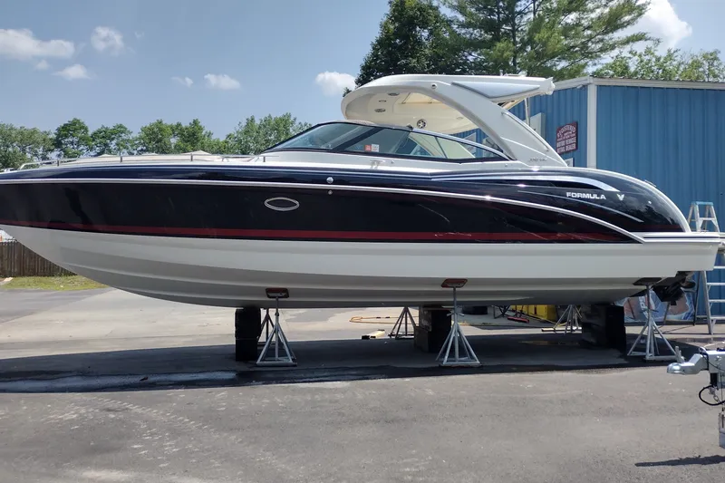 The Image of 2026 Formula 350 Crossover Bowrider on stands, sleek design, outdoors. - 1