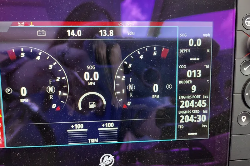 Slide: The Image of Dashboard display of a 2026 Formula 350 Crossover Bowrider, showing engine and navigation data. - 65