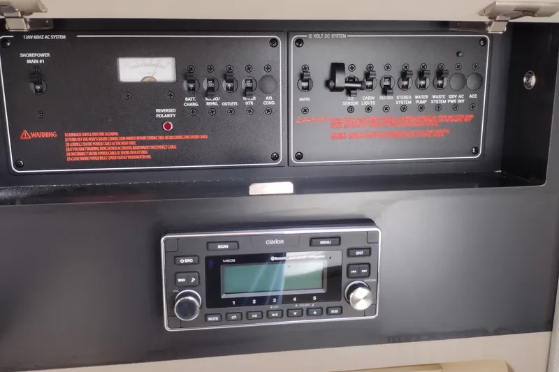 Slide: The Image of Control panel of a 2026 Formula 350 Crossover Bowrider with audio system and electrical switches. - 46